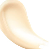Close up macro photo of Essential Moisturizer looking glossy and smooth and is a light tan natural color against a white background